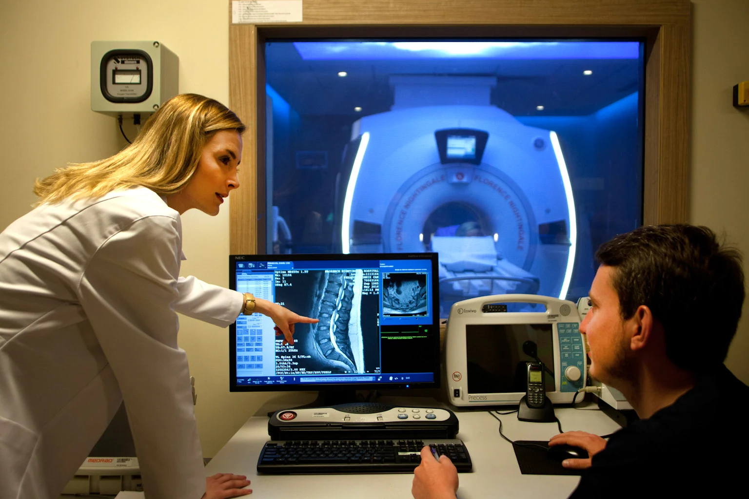 Florence medical team reviewing imaging beside an MRI scanner